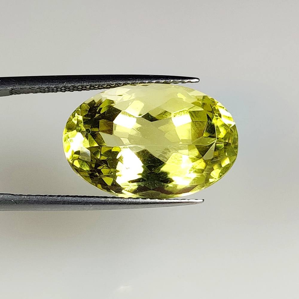 13.34 Ct Natural Lemon Quartz Oval Cut: Weight - 13.34 Ct / Dimensions - 18.50 x 12.30 x 9.70 mm / Top Quality Luster / Excellent OVal Cut / Origin - Brazil / Comments - Heated