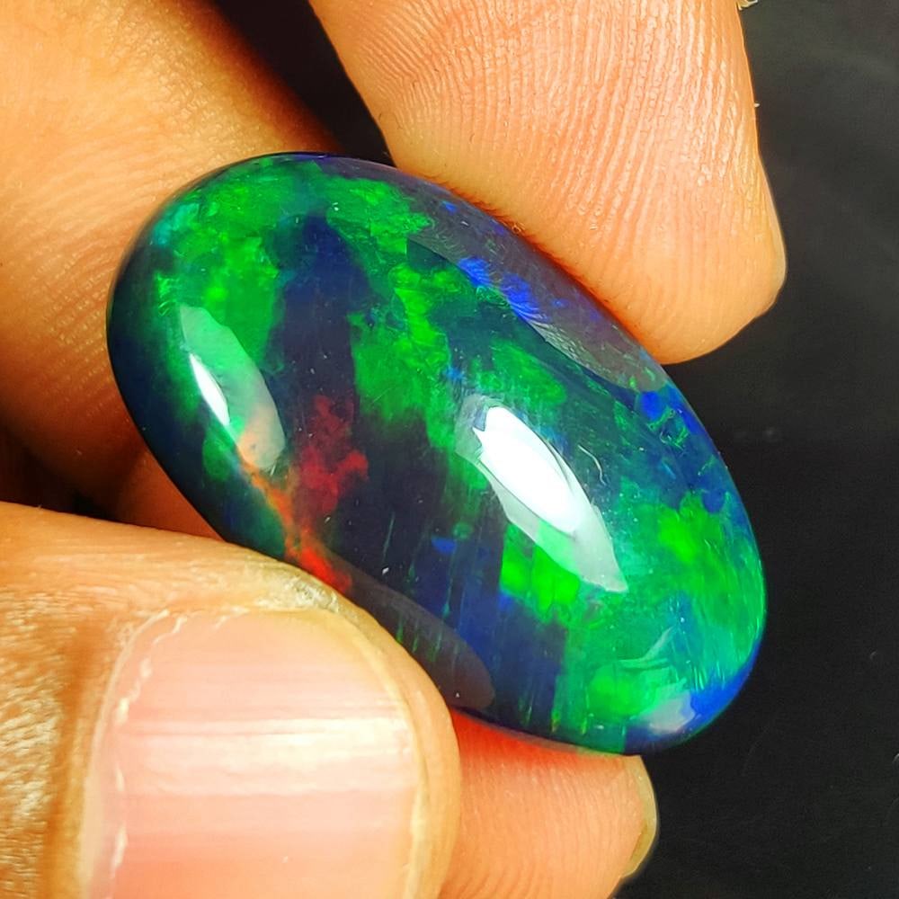 23.80 Ct Natural Black Flashing Fire Opal Oval Cab (1 of 3)