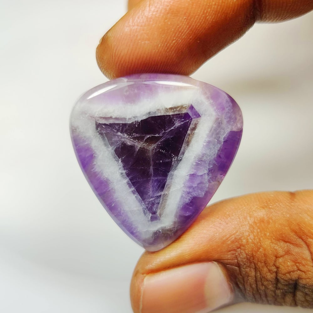 47.55 Ct Natural Chevron Amethyst Trillion Cab: Weight - 47.55 Ct / Size - 32.00 x 30.00 x 7.00 mm / Shape - Trillion Cab / Color - Purple / Clarity - Opaque / Origin -Brazil / Treatment - None