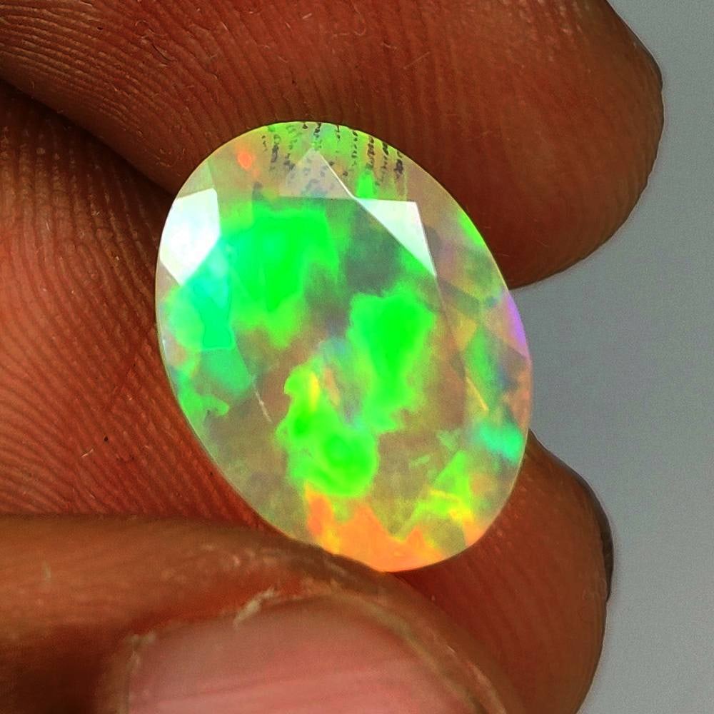 2.92 Ct Natural Multicolor Welo Opal Flash Fire Oval Cut: Weight - 2.92 Ct / Dimensions - 12.60 x 9.50 x 6.20 mm / Shape - Oval Cut / Color - Multicolor / Clarity - Translucent / Origin - Ethiopia / Treatment - None