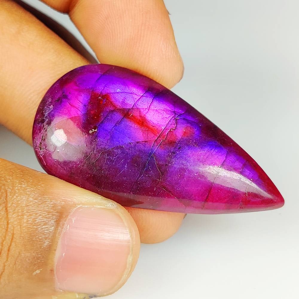 48.22 Ct Natural Purple Labradorite Pear Cab: Weight - 48.22 Ct / Size - 45.00 x 25.00 x 6.60 mm / Shape - Excellent Pear Cab / Clarity - Opaque / Origin - Africa / Treatment - None