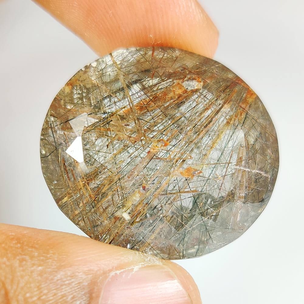 64.87 Ct Natural Rutile Quartz Oval Cut: Weight - 64.87 Ct / Dimensions - 28.00 x 25.00 x 17.00 mm / Shape & Cut - Oval Cut / Transparency - Transaprent / Origin - Norway / Comments - None