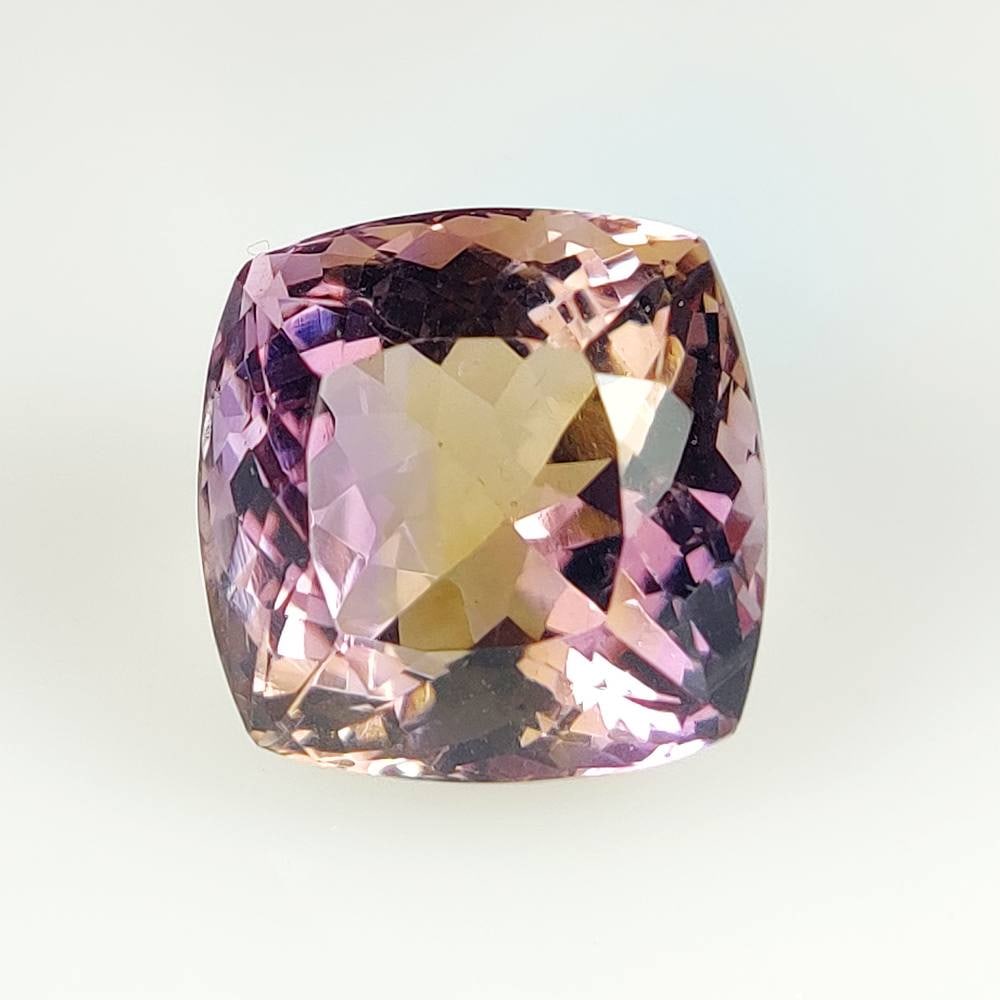 20.69 Ct Natural Bicolor Ametrine Cushion Cut: Weight - 20.69 Ct / Dimensions - 15.90 x 15.70 x 13.10 mm / Shape - Cushion Cut / Color - Bicolor / Clarity - VVS / Origin -Brazil / Treatment - None