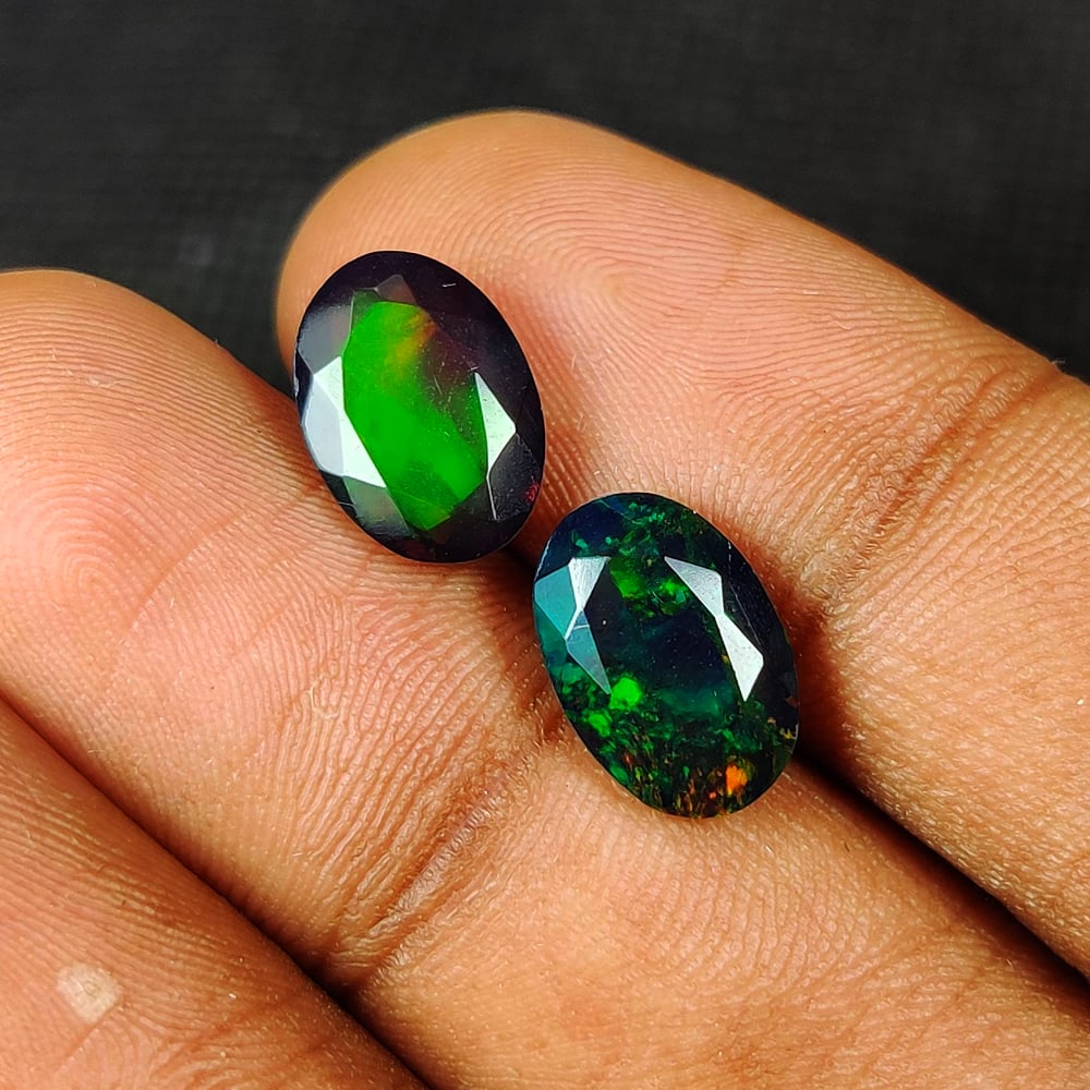 4.38 Ct Natural Black Flashing Fire Opal Oval Cut Pair: Weight - 4.38 Ct / Dimensions - 11.50 x 7.90 x 5.80 mm / 2 Pc's / Shape - Oval Cut / Color - Black / Clarity - Translucent / Origin - Ethiopia / Treatment - Color Smoked
