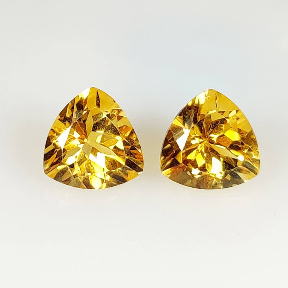 6.53 Ct Natural Yellow Citrine Trillion Cut Pair: Weight - 6.53 Ct / Size - 10.10 x 10.00 x 6.50 mm / 2 Pc's / Shape - Trillion Cut / Color - Yellow / Clarity - VVS / Origin - Brazil / Treatment - Heated