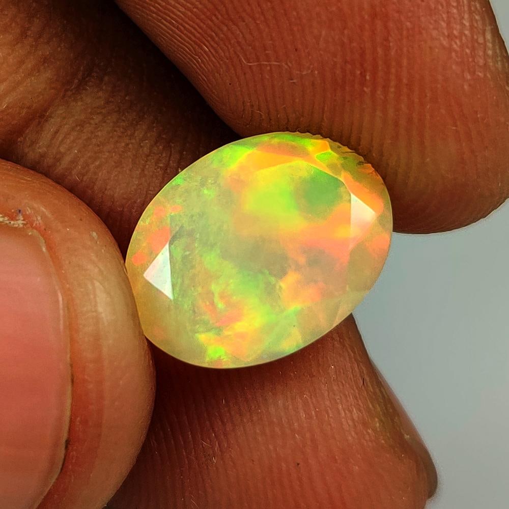 2.89 Ct Natural Multicolor Welo Opal Flash Fire Oval Cut: Weight - 2.89 Ct / Dimensions - 12.60 x 9.60 x 5.90 mm / Shape & Cut - Oval Cut / Color - Multicolor / Transparency - Translucent / Origin - Ethiopia / Comments - None