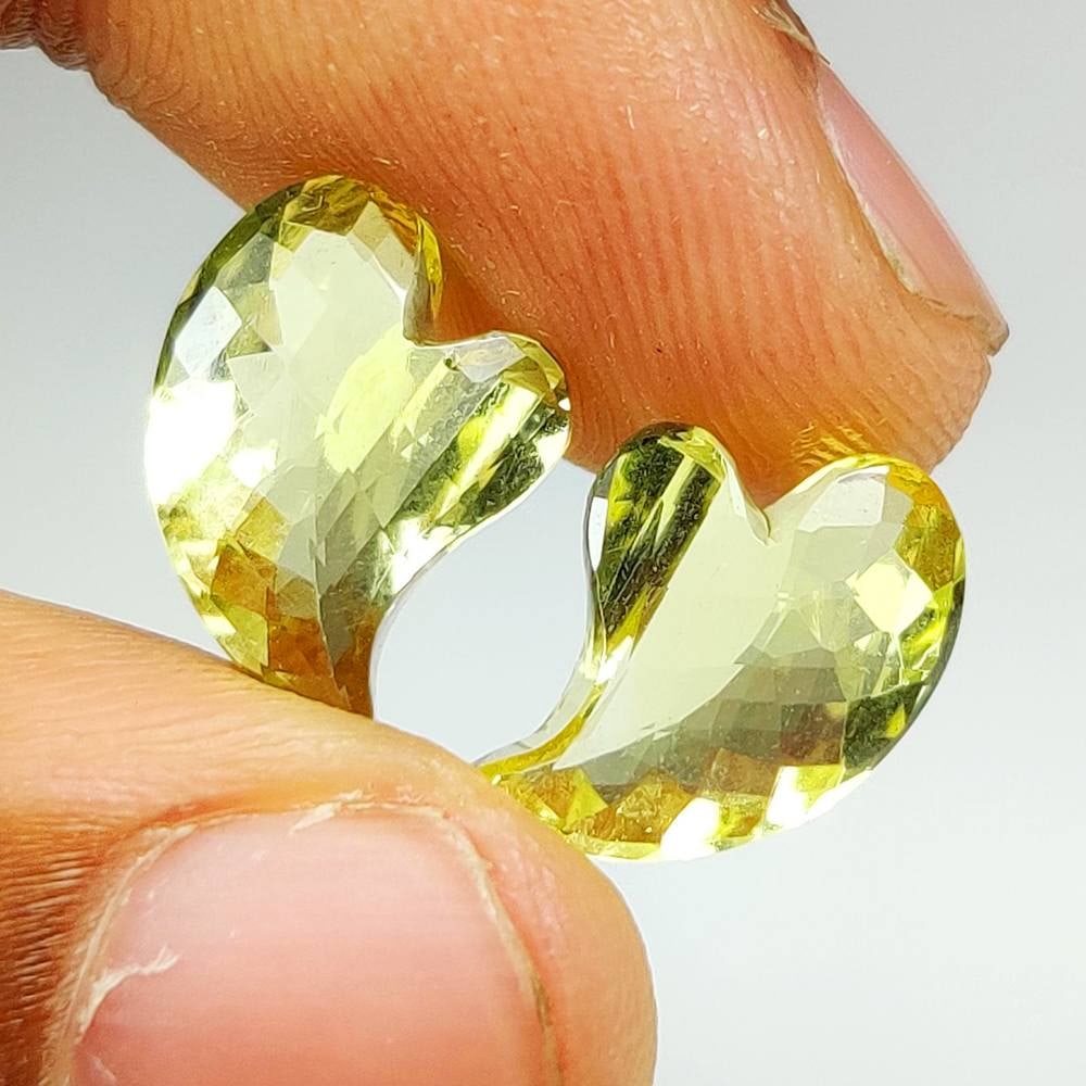 7.49 Ct Natural Lemon Quartz Fancy Cut Pair: Weight - 7.49 Ct / Dimensions - 14.30 x 10.40 x 5.70 mm / 2 Pc's / Shape - Fancy Cut / Clarity - VVS / Origin - Brazil / Treatment - Heated