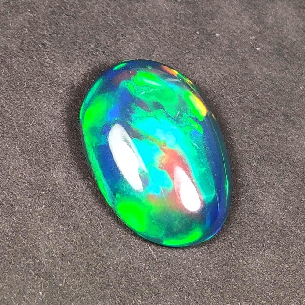 2.62 Ct Natural Black Flashing Fire Opal OVal Cab (1 of 2)