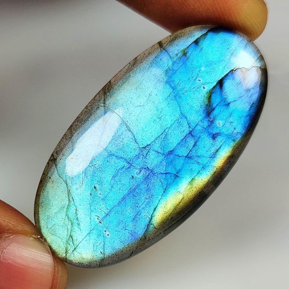 46.11 Ct Natural Blue Shaded Labradorite OVal Cab: Weight - 46.11 Ct / Size - 46.00 x 25.00 x 5.20 mm / Shape - Excellent OVal Cab / Clarity - Opaque / Origin - Africa / Treatment - None