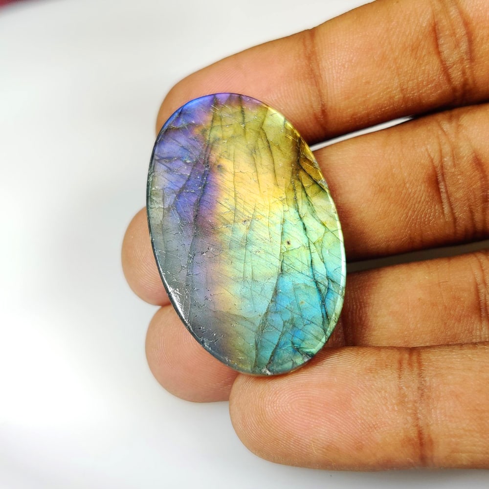 58.21 Ct Natural Labradorite Oval Cab: Weight - 58.21 Ct / Size - 41.00 x 24.50 x 6.80 mm / Shape - Excellent Oval Cab / Clarity - Opaque / Origin - Africa / Treatment - None