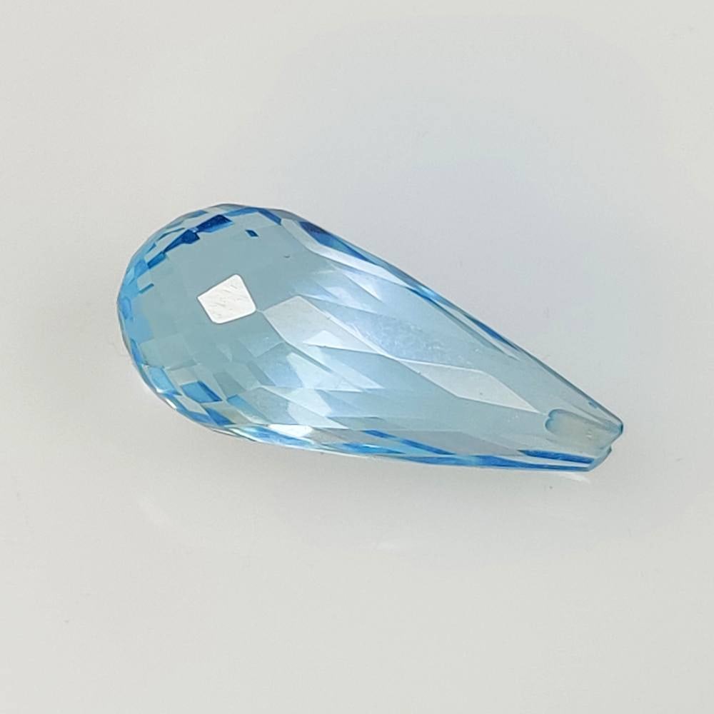 7.55 Ct Natural Blue Topaz Pear Drop: Weight - 7.55 Ct / Dimensions - 17.40 x 7.70 x 7.70 mm / Shape - Pear drop / Color - Blue / Clarity - VVS / Origin - Brazil / Treatment - Irradiated