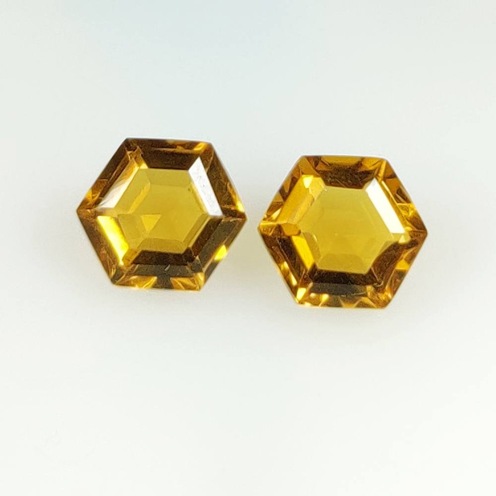 5.98 Ct Natural Yellow Citrine Hexagon cut Pair: Weight - 5.98 Ct / Dimensions - 10.30 x 9.10 x 5.70 mm / 2 Pc's / Shape & Cut - Hexagon Cut / Color - Yellow / Transparency - VVS / Origin - Brazil / Comments - Heated