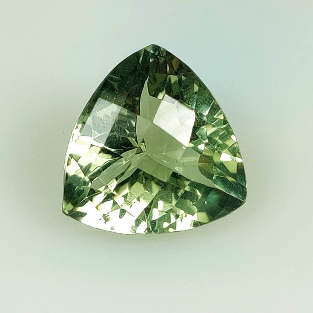 11.42 Ct Natural Green Amethyst Trillion Cut: Weight - 11.42 Ct / Size - 16.20 x 16.00 x 9.50 mm / Shape - Trillion Cut / Color - Green / Clarity - VVS / Origin - Brazil / Treatment - Heated