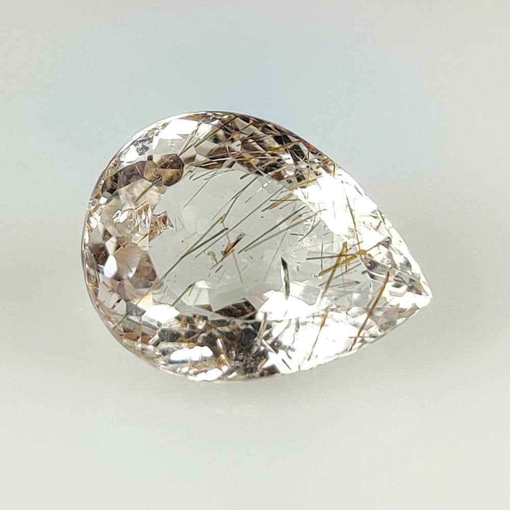 10.49 Ct Natural Rutile Quartz Pear Cut: Weight - 10.49 Ct / Size - 16.80 x 12.80 x 8.90 mm / Shape - Pear Cut / Clarity - Transparent / Origin - Norway / Treatment - None