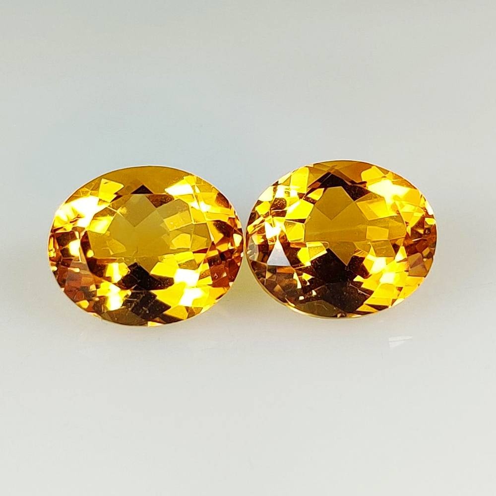 9.62 Ct Natural Madeira Citrine Oval Cut Pair: Weight - 9.62 Ct / Dimensions - 12.10 x 10.10 x 6.90 mm / 2 Pc's / Shape - Oval Cut / Color - Orange / Clarity - VVS / Origin - Brazil / Treatment - Heated