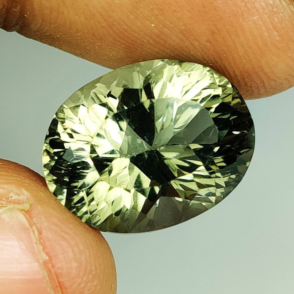 12.97 Ct Natural Green Amethyst Oval Cut: Weight - 12.97 Ct / Size - 16.50 x 12.70 x 10.90 mm / Shape - Oval Cut / Color - Green / Clarity - VVS / Origin - Brazil / Treatment - Heated