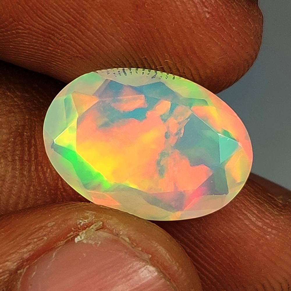 3.61 Ct Natural Multicolor Welo Opal Top Fire Oval Cut: Weight - 3.61 Ct / Dimensions - 15.20 x 10.80 x 5.20 mm / Shape - Oval Cut/ Color - Multicolor / Clarity - Translucent / Origin - Ethiopia / Treatment - None
