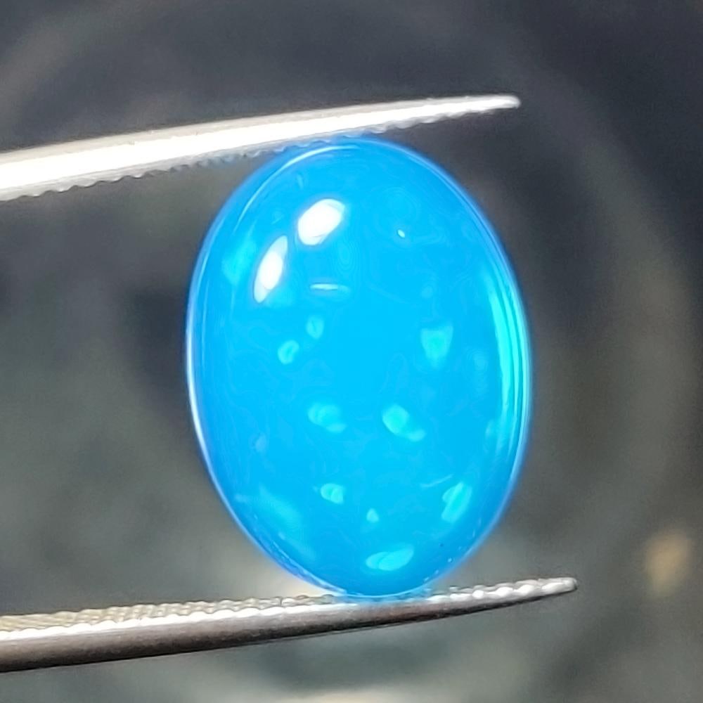 4.88 Ct Natural Blue Fire Opal Oval Cab: Weight - 4.88 Ct / Size - 15.40 x 11.40 x 5.70 mm / Shape - Oval Cab / Color - Blue / Clarity - Translucent / Origin - Ethiopia / Treatment - Color Heated