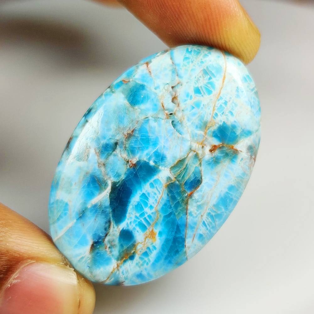 63.03 Ct Natural Larimar Oval Cab: Weight - 63.03 Ct / Dimensions -43.00 x 29.00 x 5.70 mm / Good Color / Oval Cab - Ready for Jewellery Setting / Origin - Brazil / Treatment - None