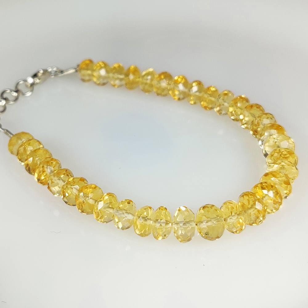 42.49 Ct Natural Yellow Citrine Round Drilled Faceted Beads Bracelet: Weight - 42.49 Ct / Dimensions - 6.10 - 6.80 mm / 34 Pc's / 7.5" inches / Shape - Round Drilled / Color - Yellow / Clarity - VVS / Origin - Brazil / Treatment - Heated