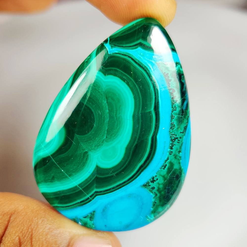 129.54 Ct Natural Azumalachite Pear Cab: weight - 129.54 Ct / Dimensions - 51.00 x 37.00 x 6.70 mm / Shape & Cut - Excellent Pear Cab / Origin - Russia / Comments - None