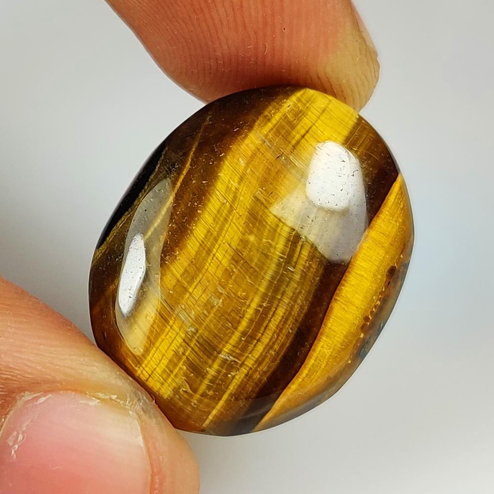 24.06 Ct Natural Tiger Eye OVal Cab: Weight - 24.06 Ct / Dimensions - 25.00 x 18.50 x 6.30 mm / Top Class Quality / Oval Cab / Origin - Burmese / Comments - None