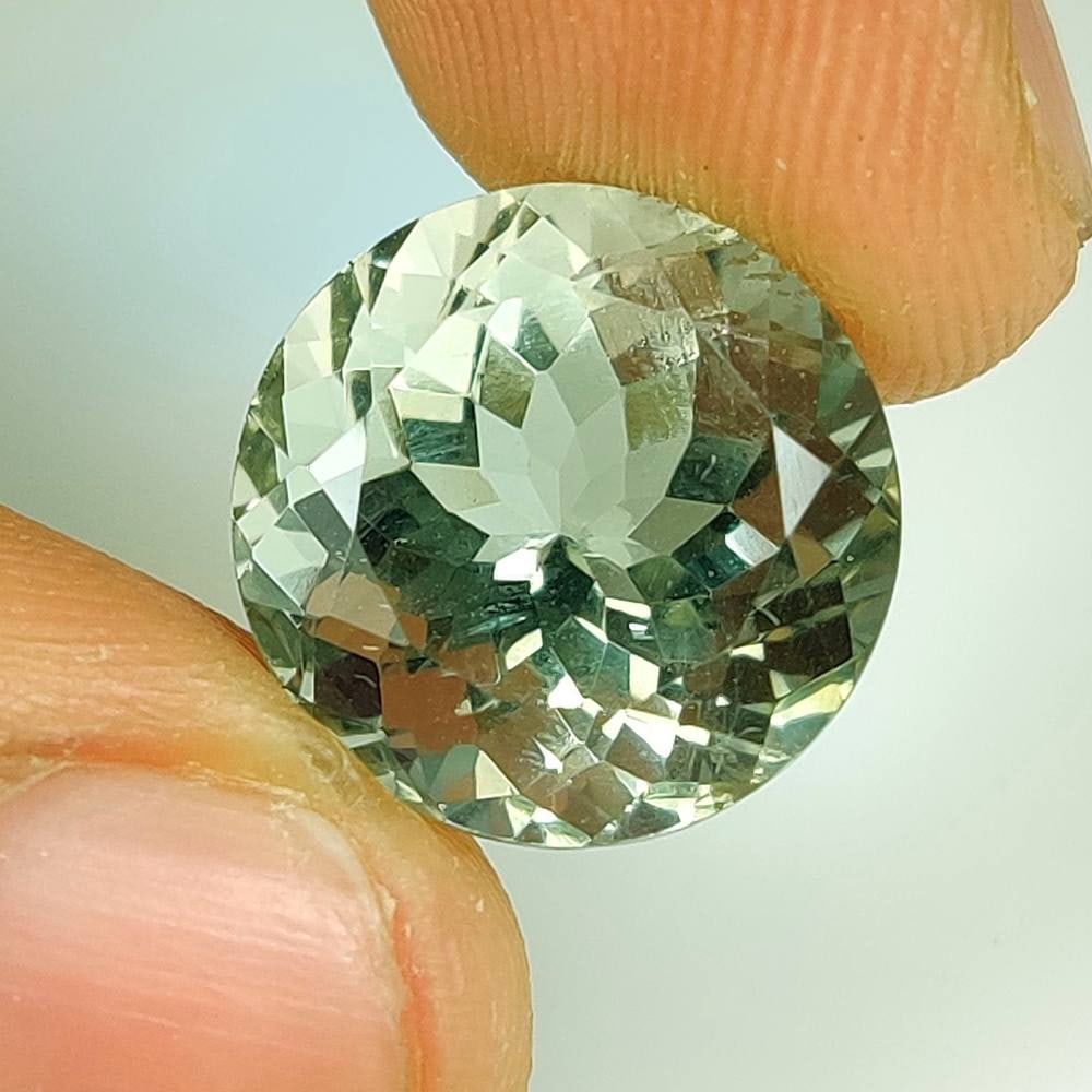 10.97 Ct Natural Green Amethyst Round Cut: Weight - 10.97 Ct / Dimensions - 14.00 x 14.00 x 10.40 mm / Shape - Round Cut / Color - Green / Origin - Brazil / Treatment - Heated