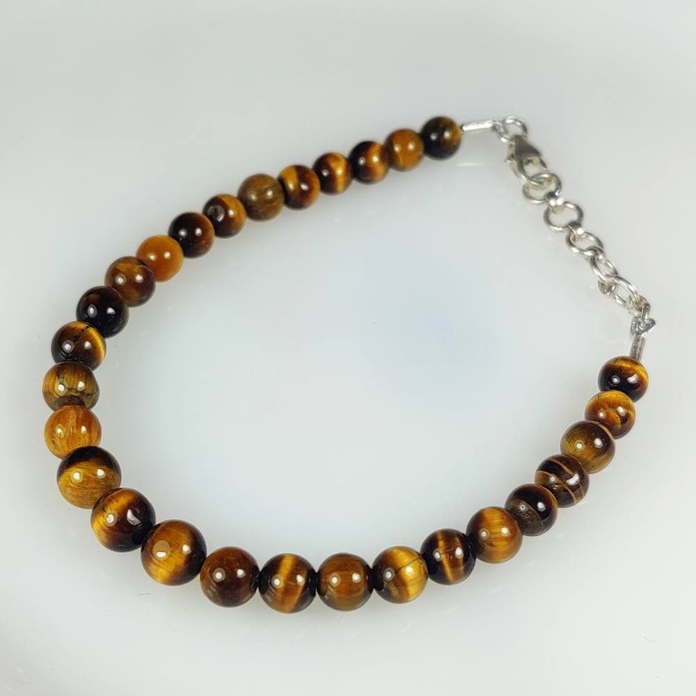 30.36 Ct Natural Tiger Eye 7" Round Beads bracelet: weight - 30.36 Ct / Dimensions - 5.00 - 5.80 mm / 28 Pc's / 7" inches / Shape - Excellent Round Beads / Origin - Burma / Treatment - None
