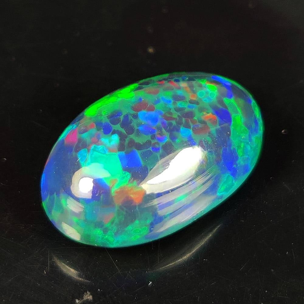 20.91 Ct Natural Black Flashing Fire Opal Oval Cab (1 of 3)