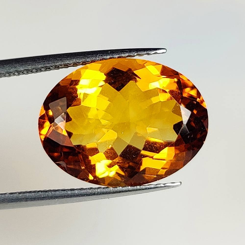 8.36 Ct Natural Citrine Oval Cut: Weight - 8.36 Ct / Size - 16.10 x 12.20 x 7.60 mm / Shape - Oval Cut / Color - Orange / Clarity - VVS / Origin - Brazil / Treatment - Heated