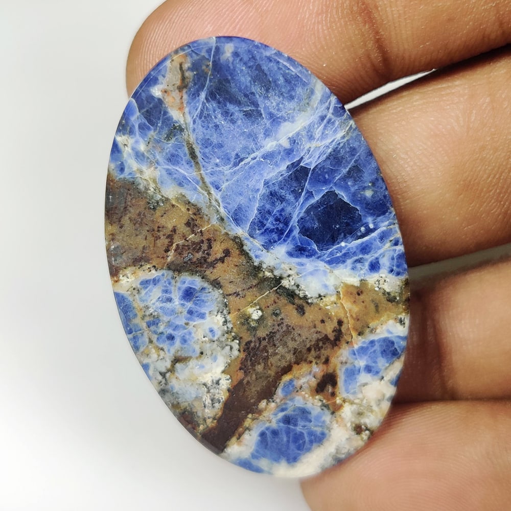 63.68 Ct Natural Blue Sodalite Oval Cab: Weight - 63.68 Ct / Size - 44.00 x 29.00 x 6.80 mm / Shape - Oval Cab / Clarity - Opaque / Origin - Russia / Treatment - None