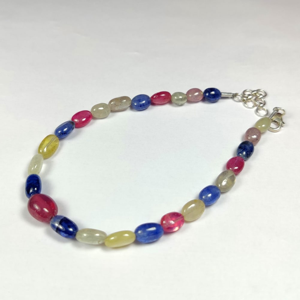 47.37 Ct Natural Multicolor Sapphire Dumbbell Beads Bracelet: Weight - 47.37 Ct / Dimensions- 6.6x5.2 - 9.0x7.3 mm / 25 Pc's / Shape - Dumbbell Beads / Clarity - SI / Origin - Sri Lanka / Comments - Standard Heated