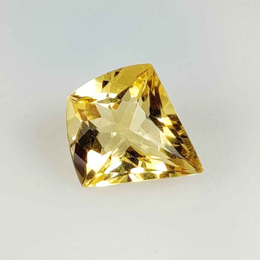 5.90 Ct Natural Yellow Citrine Fancy Cut: Weight - 5.90 Ct / Size - 15.00 x 13.60 x 8.00 mm / Shape - Fancy Cut / Color - Yellow / Clarity - VVS / Origin - Brazil / Treatment - Heated