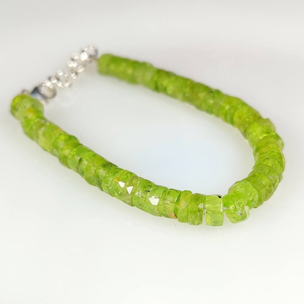 57.32 Ct Natural Green Peridot 6.5" Round Beads Bracelet: Weight - 57.32 Ct / Dimensions - 5.80 - 6.20 mm / 52 Pc's / 6.75" inches / Shape - Round Beads / Color - Green / Transparent / Origin - Pakistan / Treatment - None