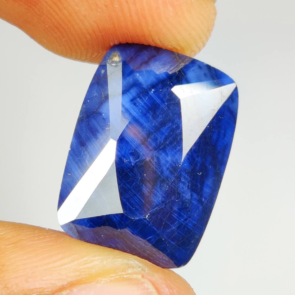 18.88 Ct Natural Blue Sapphire Cushion Cut: Weight - 18.88 Ct / Dimensions - 17.70 x 13.00 x 8.00 mm / Shape - Cushion Cut / Clarity - Opaque / Origin - Sri Lanka / Treatment - Diffused