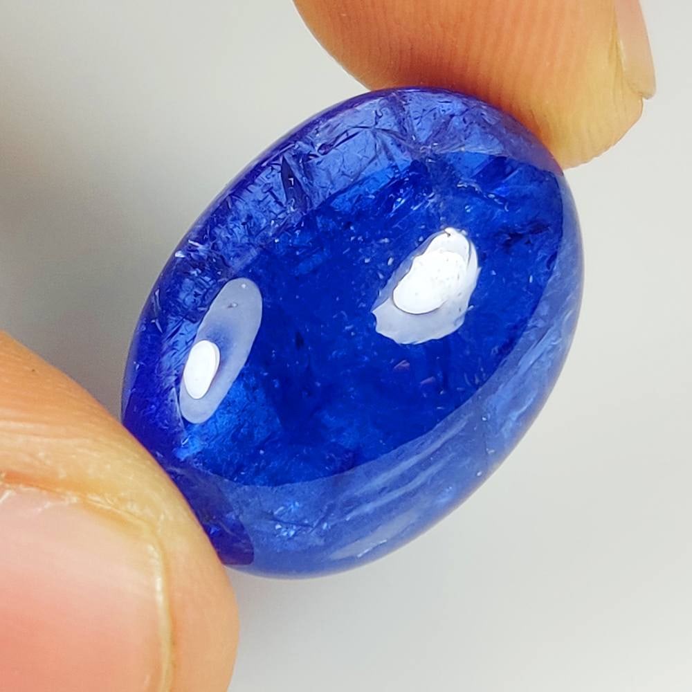 28.09 Ct Natural Tanzanite Oval Cab: Weight - 28.09 Ct / Dimensions - 23.00 x 15.90 x 8.80 mm / Shape & Cut - Oval Cab / Transparency - Transparent / Origin - Tanzania / Comments - Standard Heated