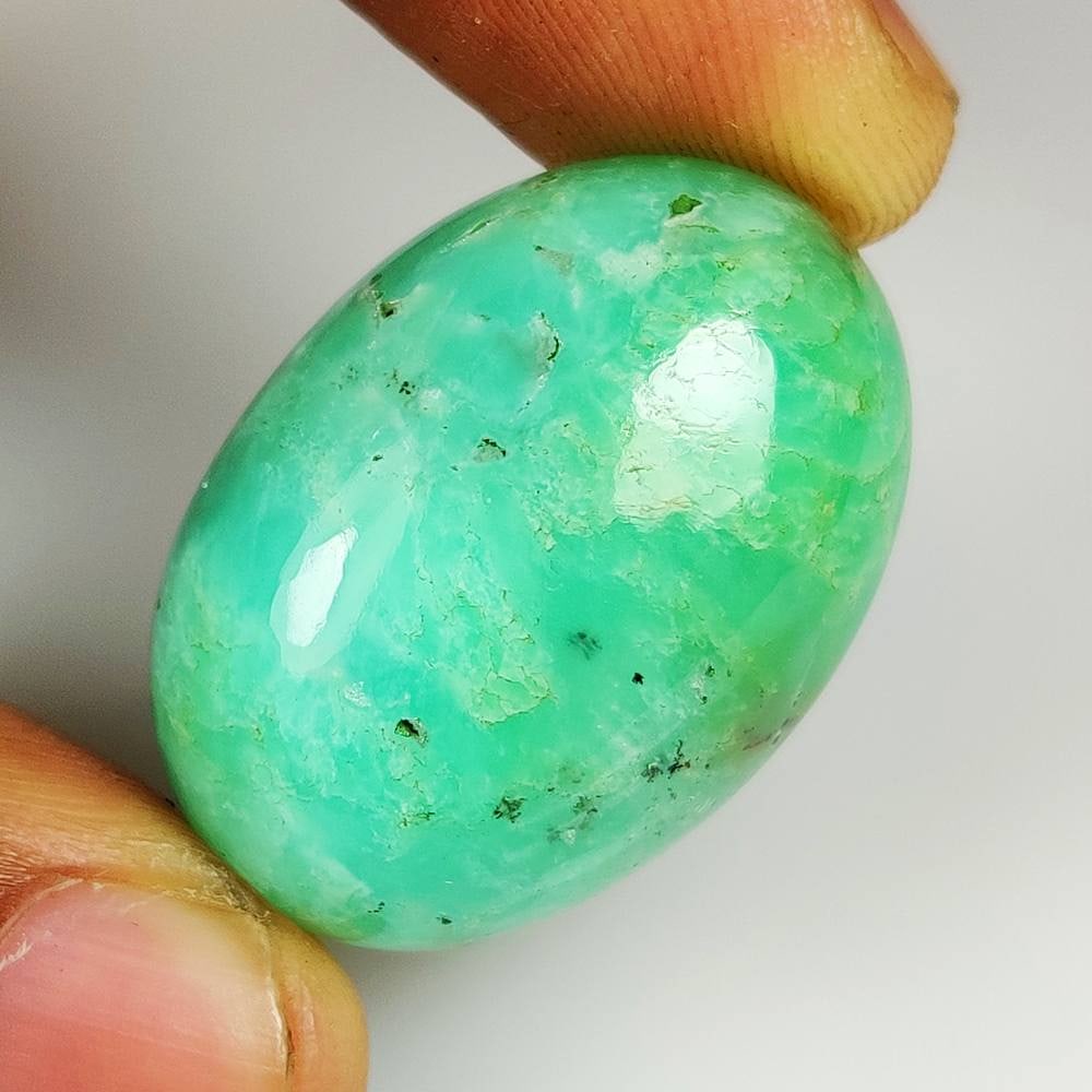 66.62 Ct Natural Green Chrysoprase OVal Cab: Weight - 66.62 Ct / Size -32.00 x 23.00 x 12.90 mm / Shape - Oval Cab / Clarity - Opaque / Origin - Brazil / Treatment - None