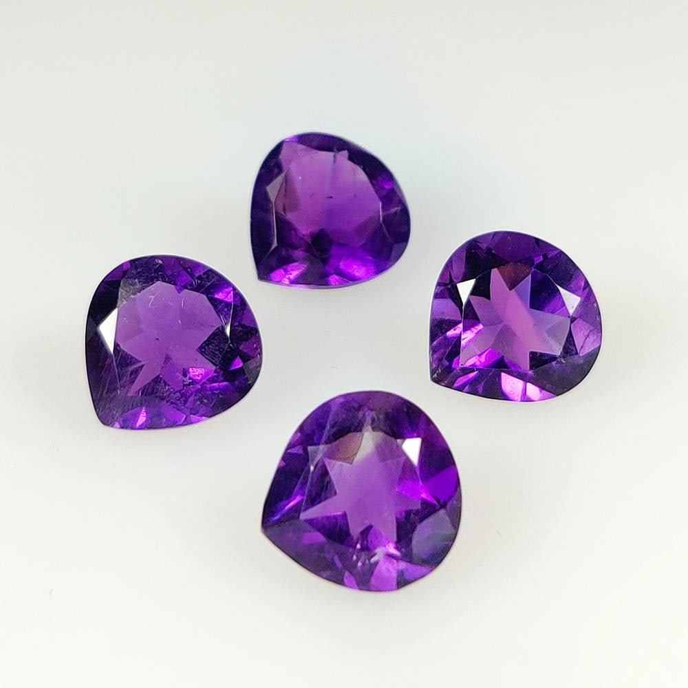 11.52 Ct Natural Purple Amethyst Pear Cut Set: Weight - 11.52 Ct / Dimensions -9.8x5.6 - 10.2x5.8 mm / 4 Pc's / Shape - Pear Cut / Color - Purple / Clarity - VVS / Origin -Brazil / Treatment - Heated