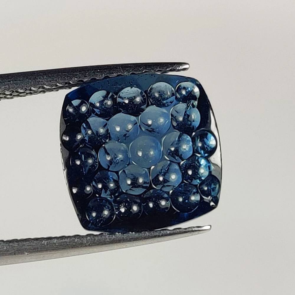 4.86 Ct Natural London Blue Topaz Cushion Carving Cab: Weight : 4.86 Ct / Dimensions : 10.20 x 10.20 x 6.20 mm / Shape : Cushion Carving Cab / Color : Blue / Transparency : Transparent / Treatment : Irradiated