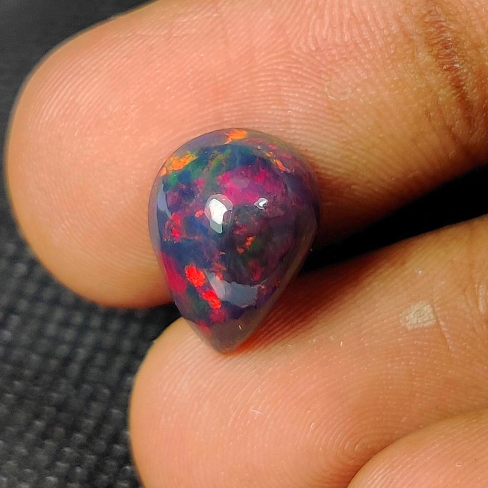 3.28 Ct Natural Black Fire Opal Pear Cab (1 of 2)