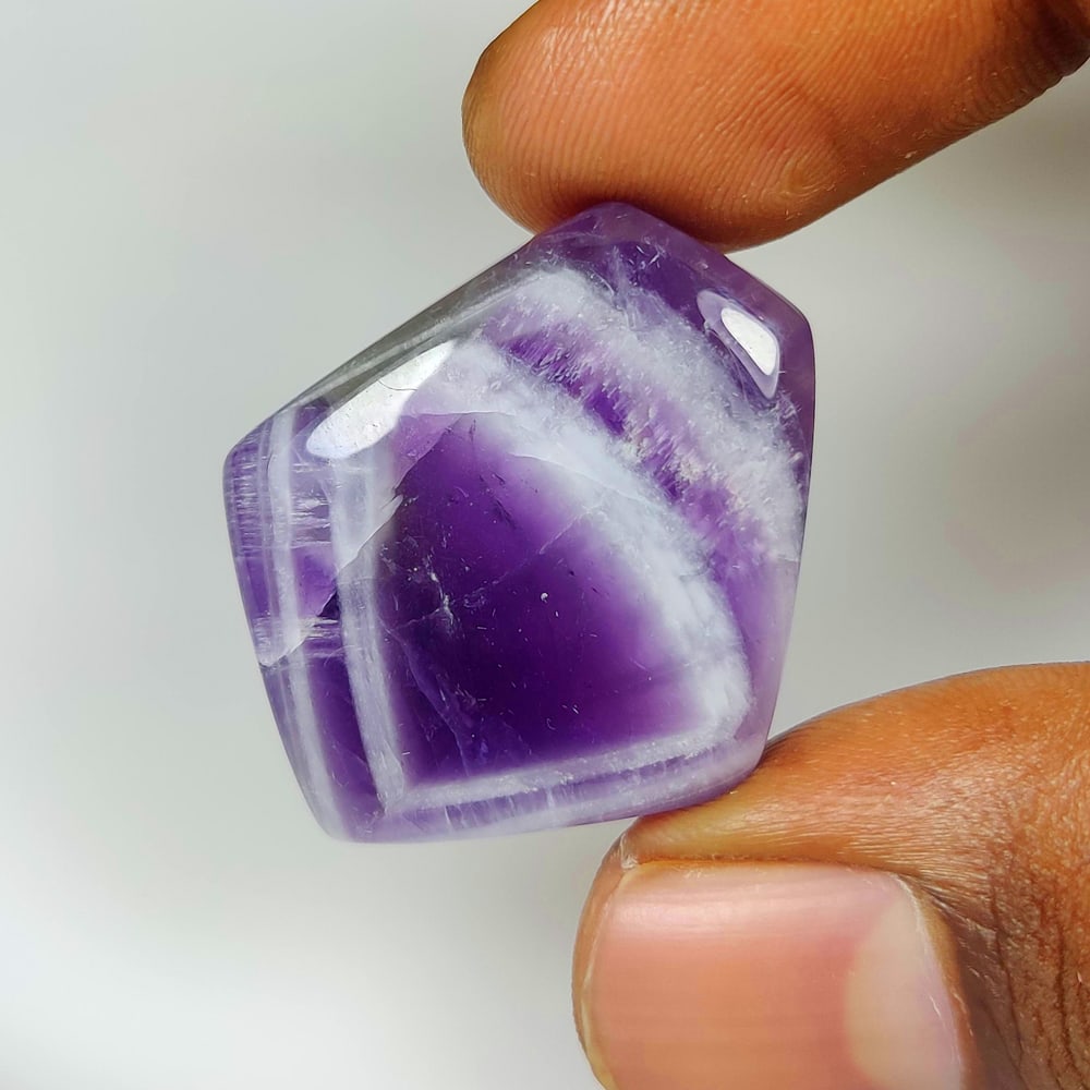 46.10 Ct Natural Chevron Amethyst Fancy Cab: Weight - 46.10 Ct / Size - 32.00 x 27.00 x 7.60 mm / Shape - Fancy Cab / Color - Purple / Clarity - Opaque / Origin -Brazil / Treatment - None