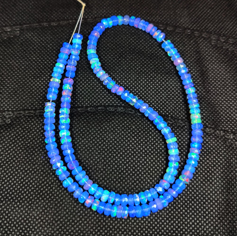 54.22 Ct Natural Blue Fire Opal Round Cut Beads: Weight - 54.22 Ct / Size - 5.00 - 5.40 mm / 141 Pc's / Shape - Round Beads / Clarity - Translucent / Origin - Ethiopia / Treatment - Heated