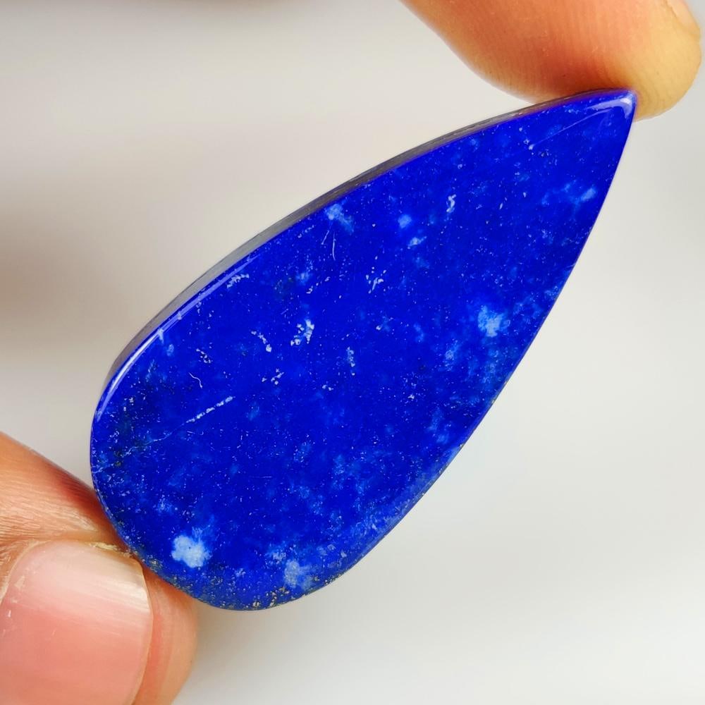 60.49 Ct Natural Blue Lapis Lazuli Pear Cab: Weight - 60.49 Ct / Size - 43.00 x 20.30 x 7.00 mm / Shape - Pear Cab / Clarity - Opaque / Origin - Afghanisthan / Treatment - None