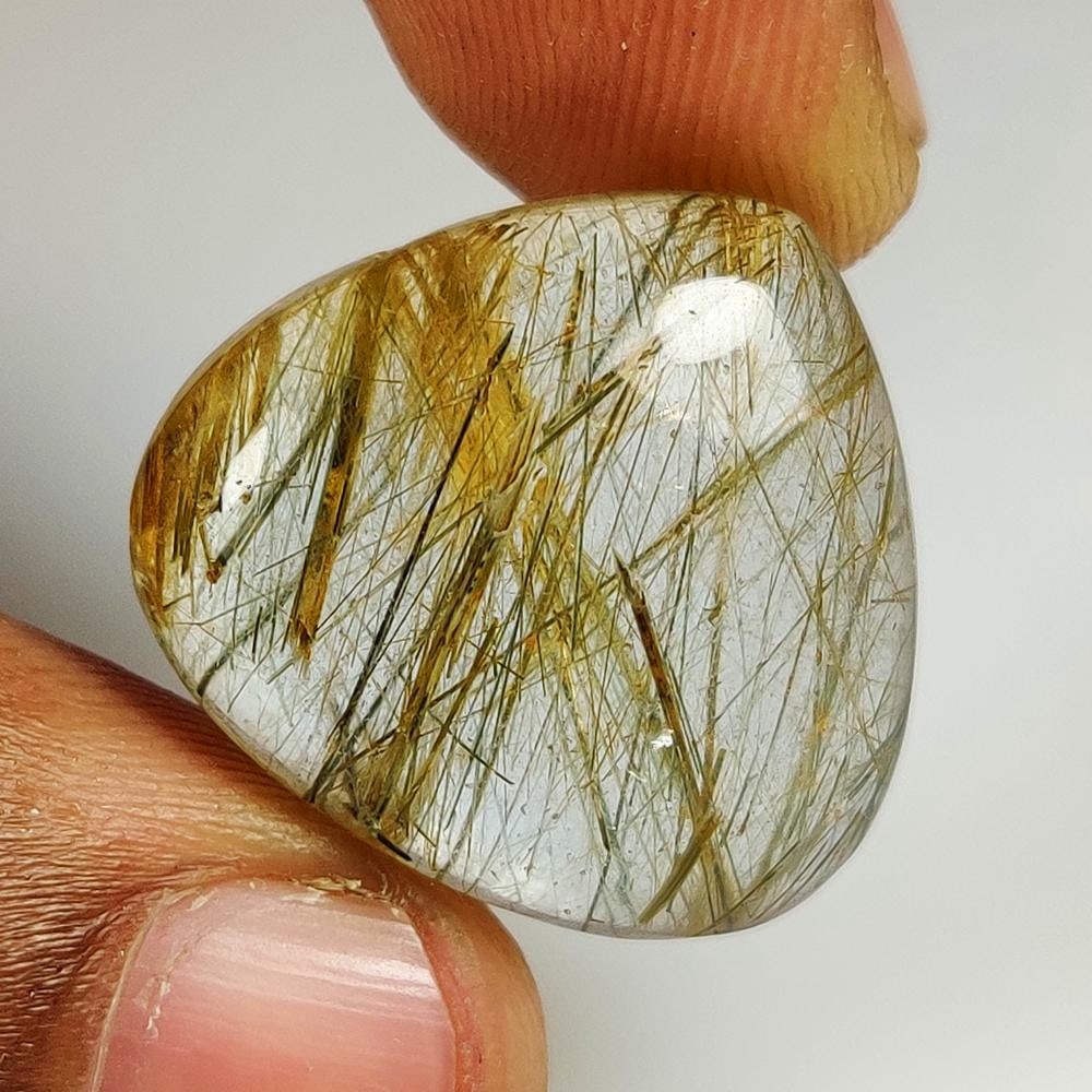 25.90 Ct Natural Rutile Quartz Pear Cab: Weight - 25.90 Ct / Size - 24.00 x 22.00 x 7.40 mm / Shape - Pear Cab / Clarity - Transparent / Origin - Norway / Treatment - None