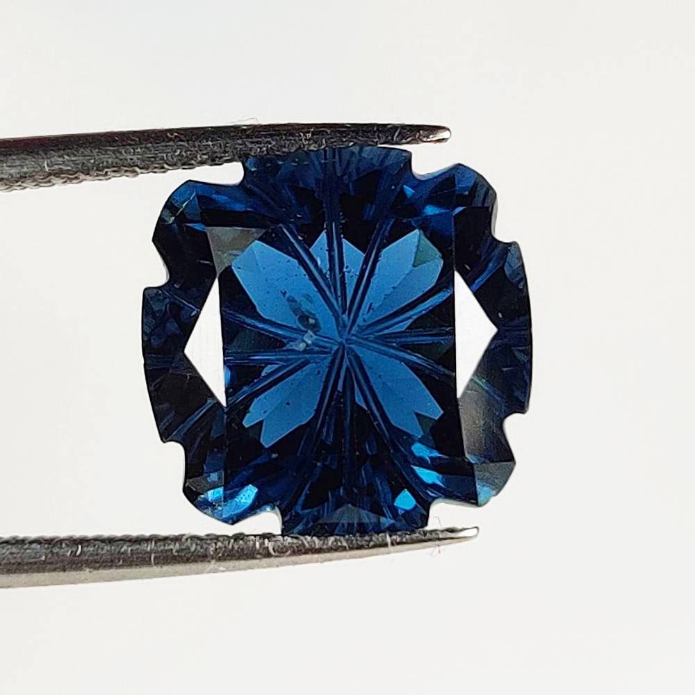 7.36 Ct Natural London Blue Topaz Cushion Carving Cut: Weight - 7.36 Ct / Size - 11.80 x 11.80 x 7.00 mm / Shape - Cushion Carving Cut / Color - Deep Blue / Clarity - VVS / Origin - Brazil / Treatment - Irradiated