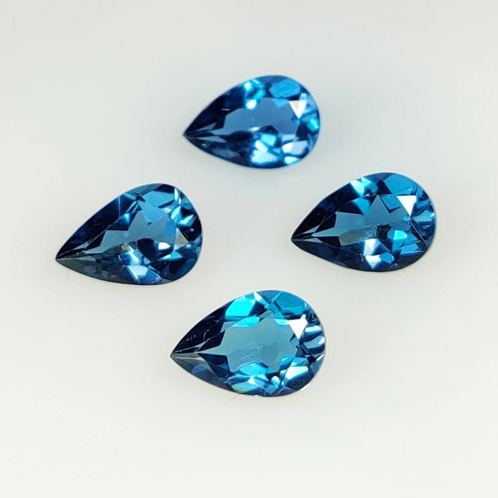 5.74 Ct Natural London Blue Topaz Pear Cut Set: Weight - 5.74 Ct / Dimensions - 9.1x3.8 - 9.1x4.0 mm / 4 Pc's / Shape & Cut - Pear cut / Color - Blue / Transparency - Transparent / Comments - Irradiated