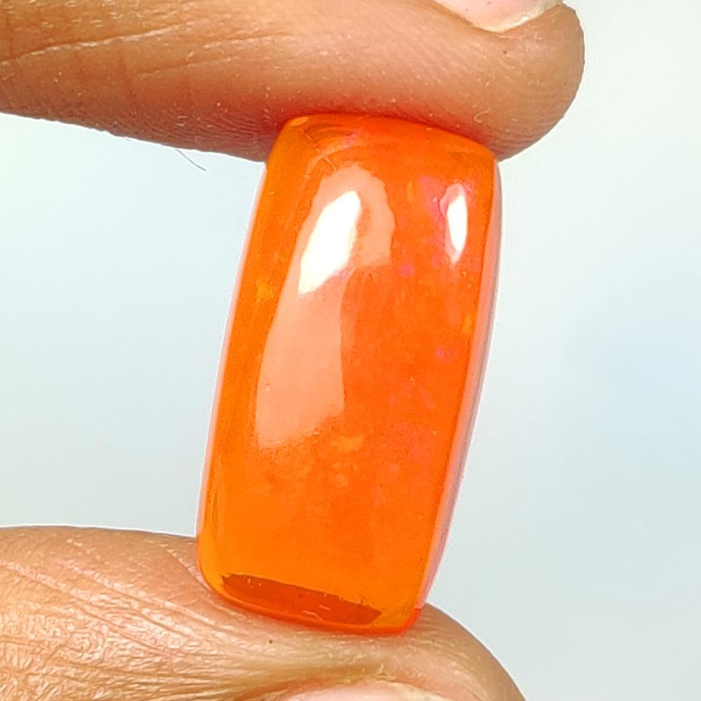 4.56 Ct Natural Orange Fire Opal Cushion Cab: Weight - 4.56 Ct / Size - 17.20 x 9.00 x 5.60 mm / Shape - Cushion Cab / Color - Orange / Clarity - Translucent / Origin - Ethiopia / Treatment - Color Heated