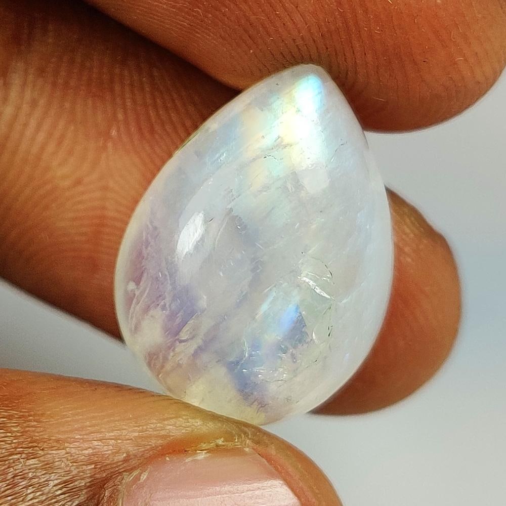 13.62 Ct Natural Blue Tint Moonstone Pear Cab: Weight - 13.62 Ct / Size - 18.70 x 13.80 x 7.40 mm / Shape - Pear Cab / Clarity - Semi-Transparent / Origin - India / Treatment - None