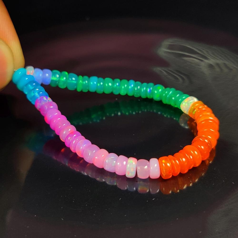 18.83 Ct Natural Multicolor Fire Opal Round Beads: Weight - 18.83 Ct / Size - 5.10 - 5.60 mm / 59 Pc's / 5.5" inches / Shape - Round Beads / Clarity - Translucent / Origin - Ethiopia / Treatment - Heated