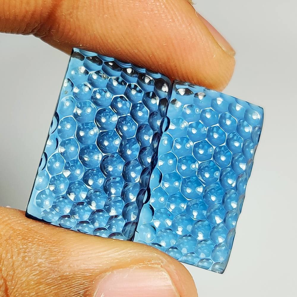 30.20 Ct Natural London Blue Topaz Octagon Carving Pair: Weight - 30.20 Ct / Dimensions - 21.50 x 13.00 x 4.80 mm / 2 Pc's / Shape & Cut - Octagon Carving Cab / Color - Blue / Transparency - Transparent / Comments - Irradiated